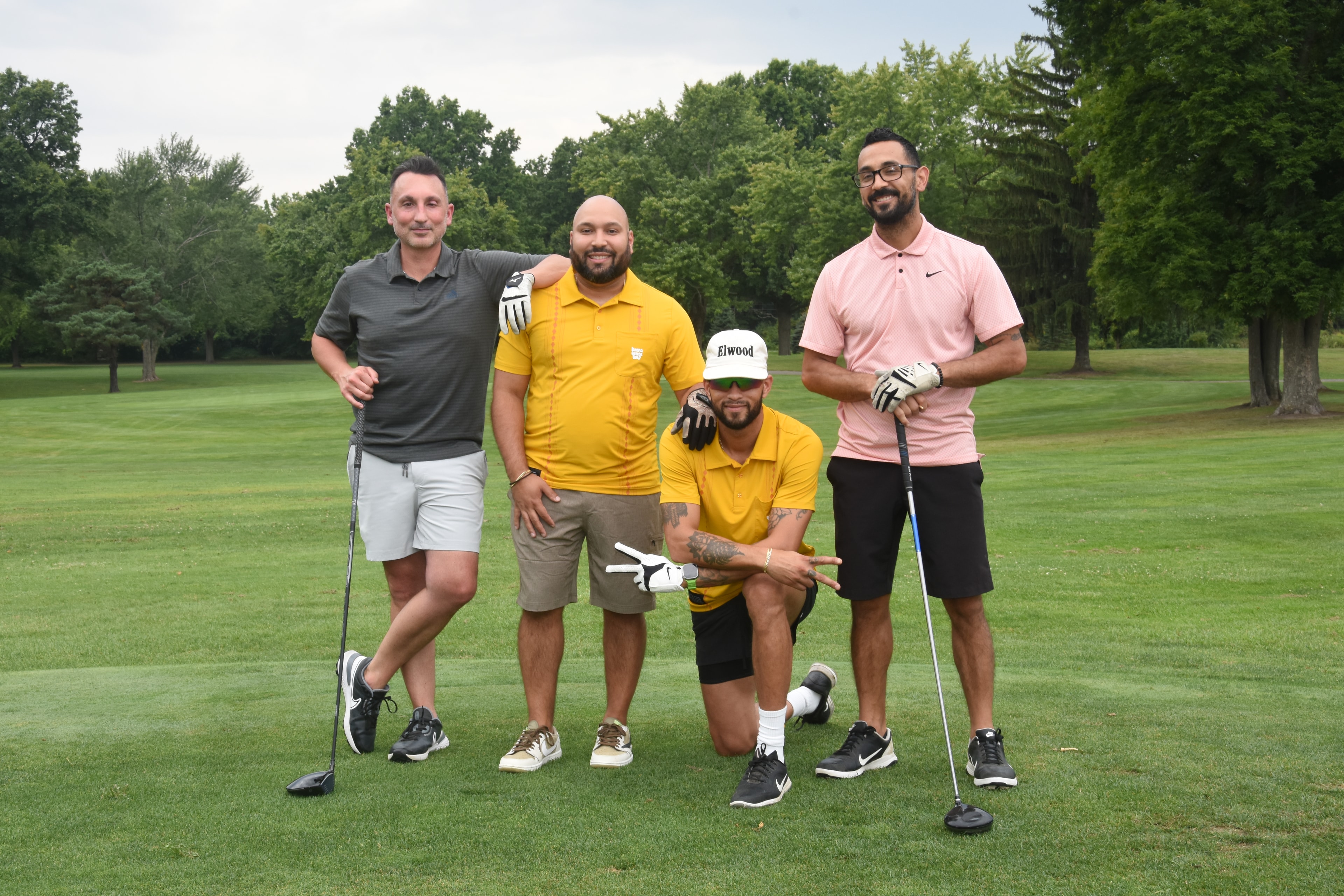Foursome posing on the fairway