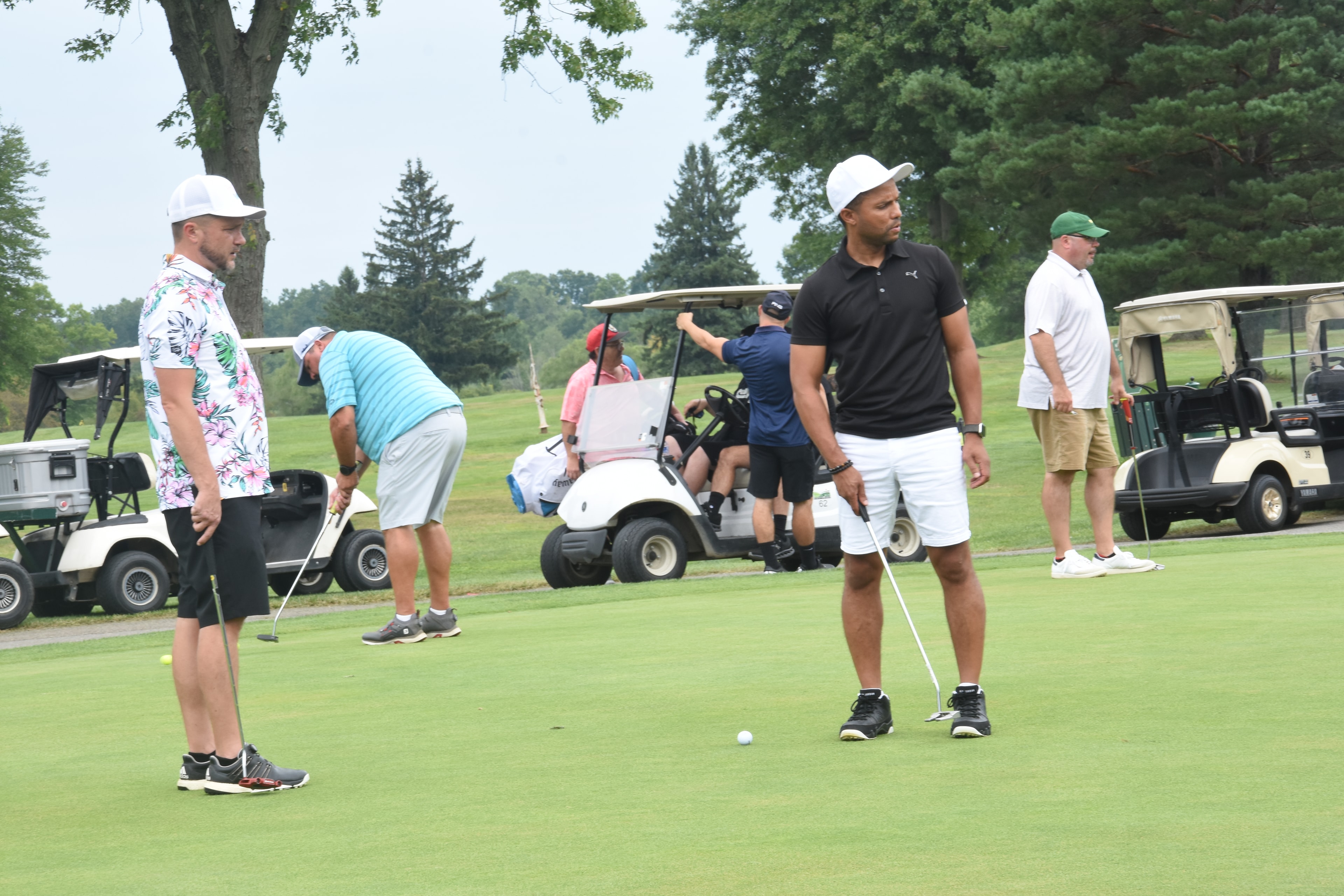 Golfers on the green during the outing