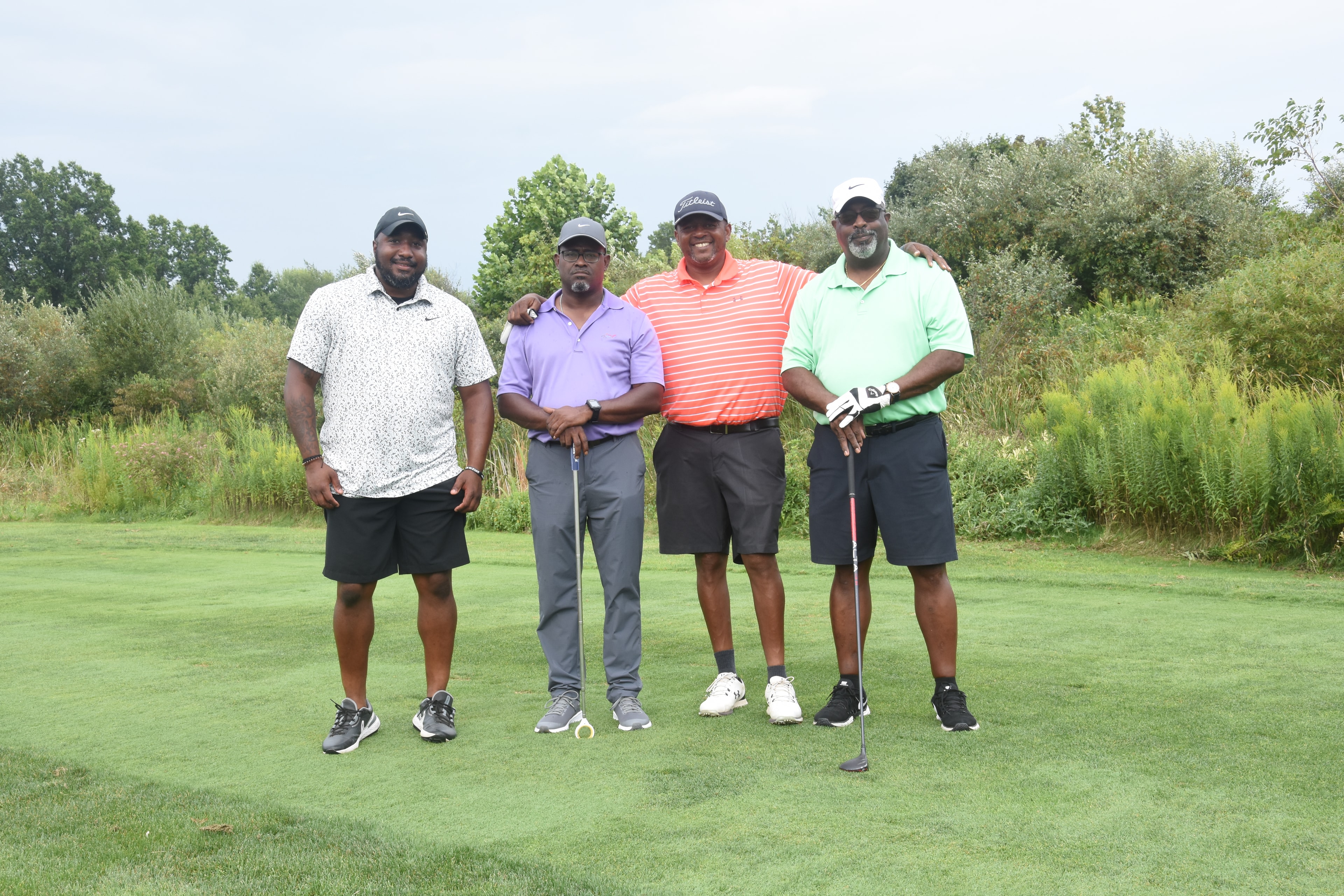 Golf outing participants posing together